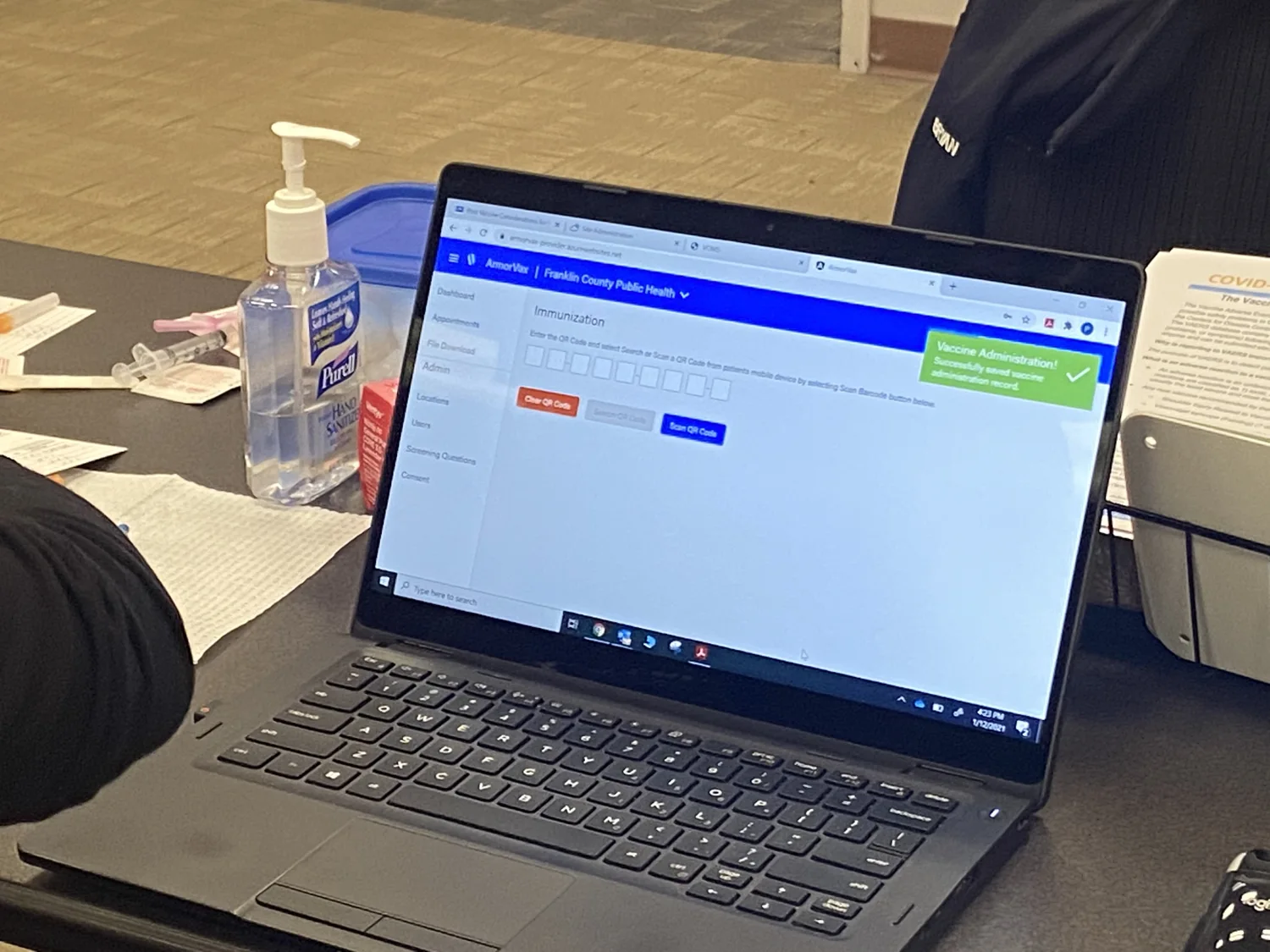 ArmorVax software displayed on laptop at a vaccination site