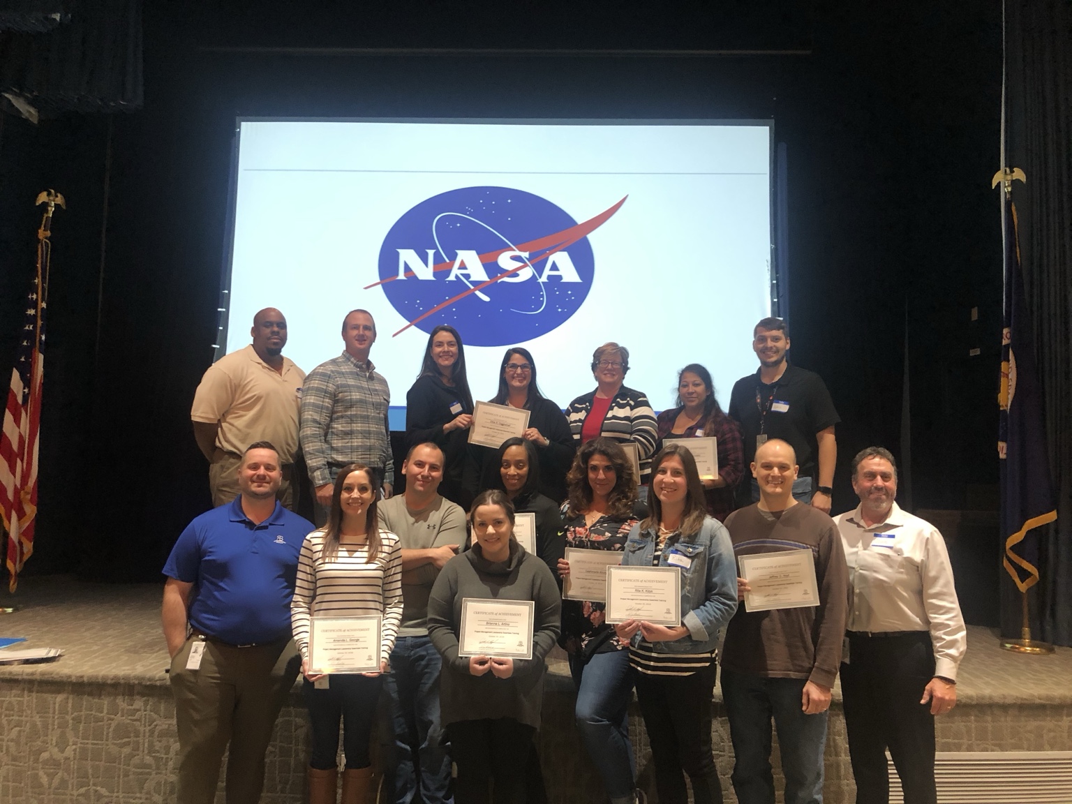 NASA training program group with certificates